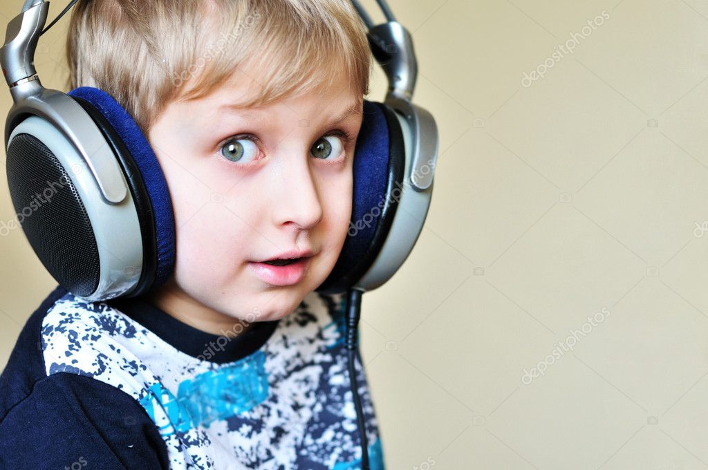 Person relaxing with headphones on, listening to music from a playlist