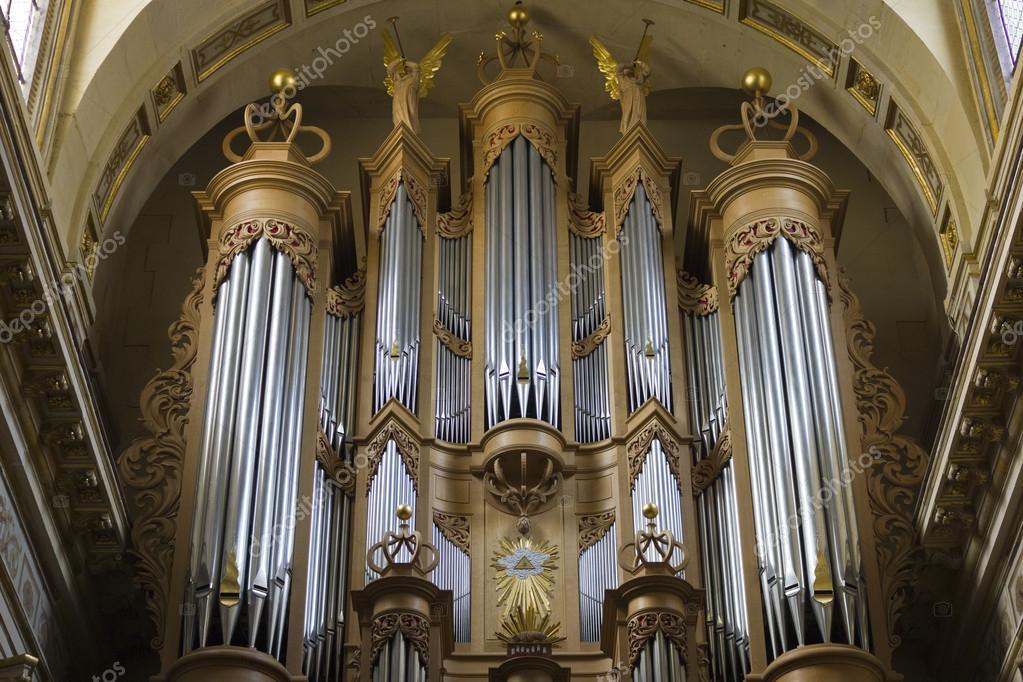 Softly lit church interior with a piano ready for worship