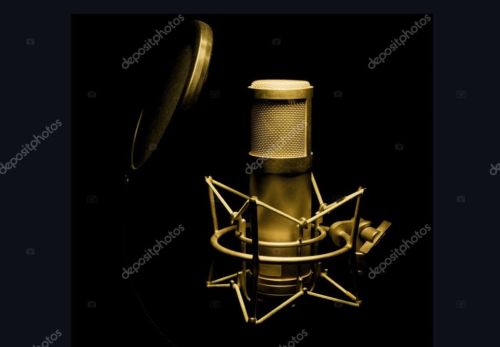Hip-hop artist recording vocals in a studio